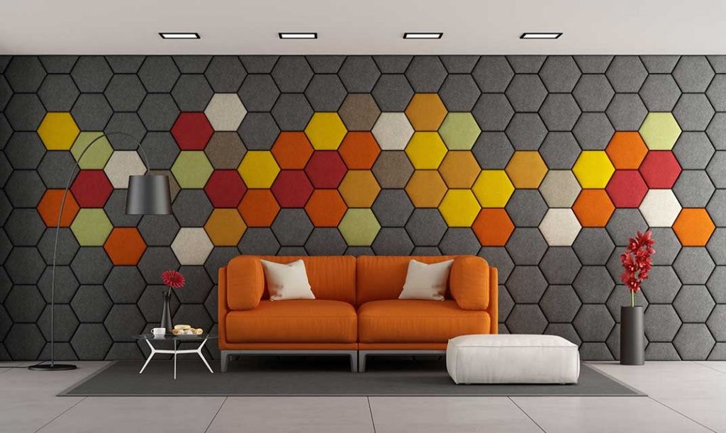 modern-living-room-with-white-sofa-and-colorful-hexagonal-panels-on-wall.jpg